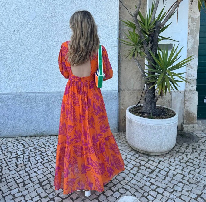 consumer wearing a long slow fashion dress