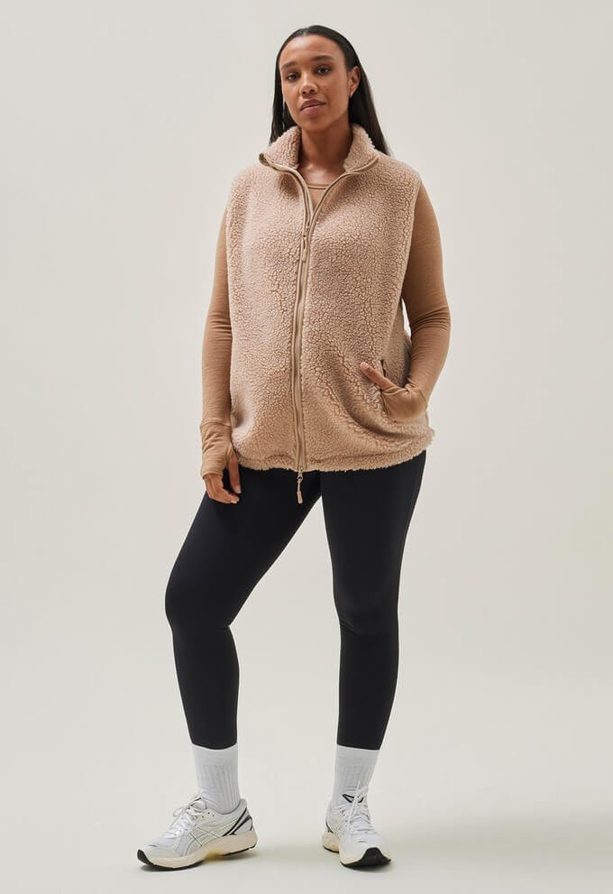 Consumer wearing sustainable fleece garments